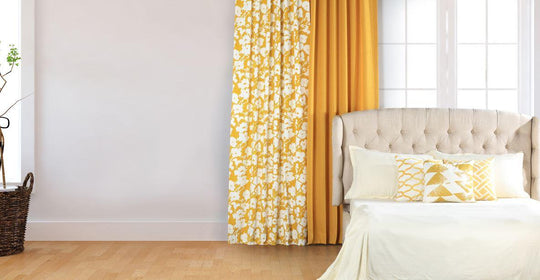 yellow cotton curtains hanging in bedroom
