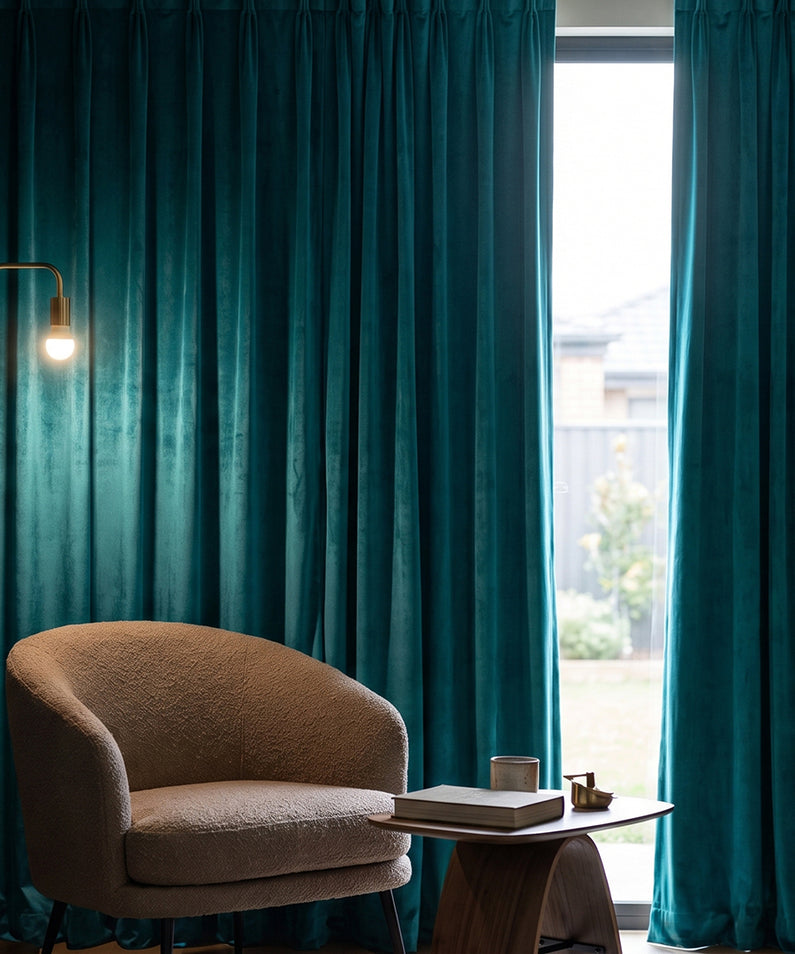 Hunter Green Velvet: Hunter green velvet curtains bring rich color and luxurious texture to a sophisticated bedroom with warm wood details.