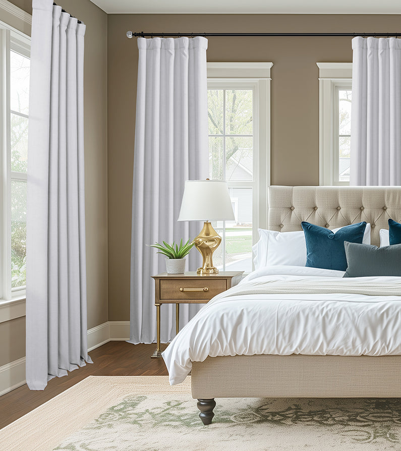 Chalk Off White: Chalk off-white curtains frame tall bedroom windows, creating a bright, polished space with neutral bedding and teal accents.