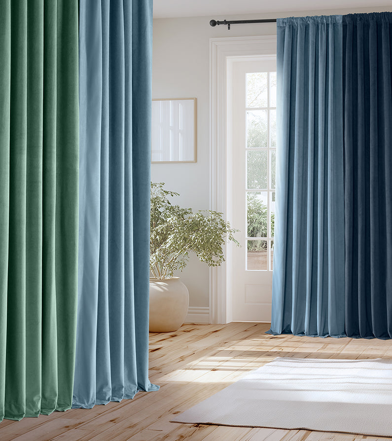 Coastal Blues: Flowing curtains in sea-inspired greens and blues create a cool, calming palette with an easy coastal feel.