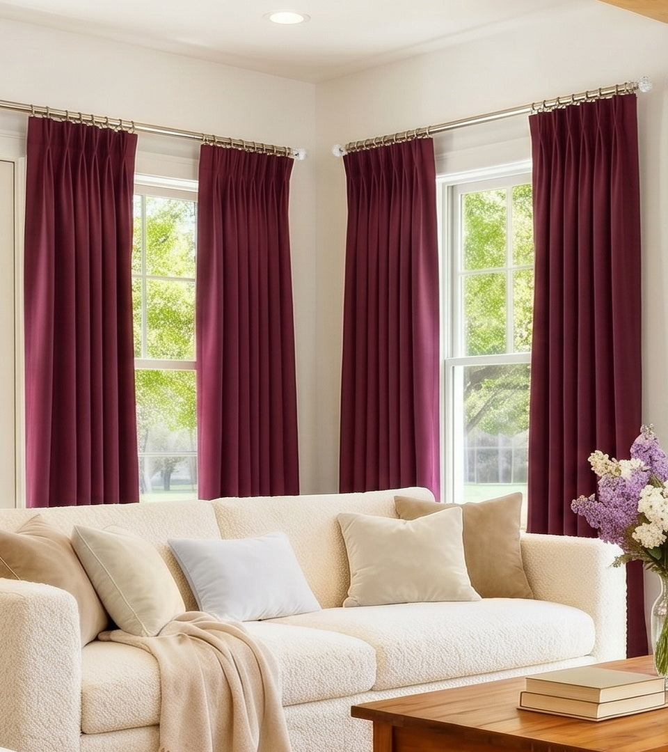 Custom French pleat curtains styled in a sophisticated interior.