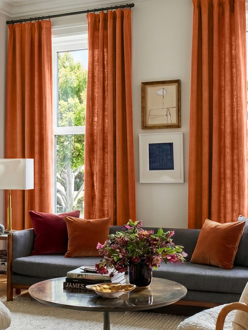 Burnt orange textured faux linen curtains hanging in a modern living room with decorative pillows and natural light.