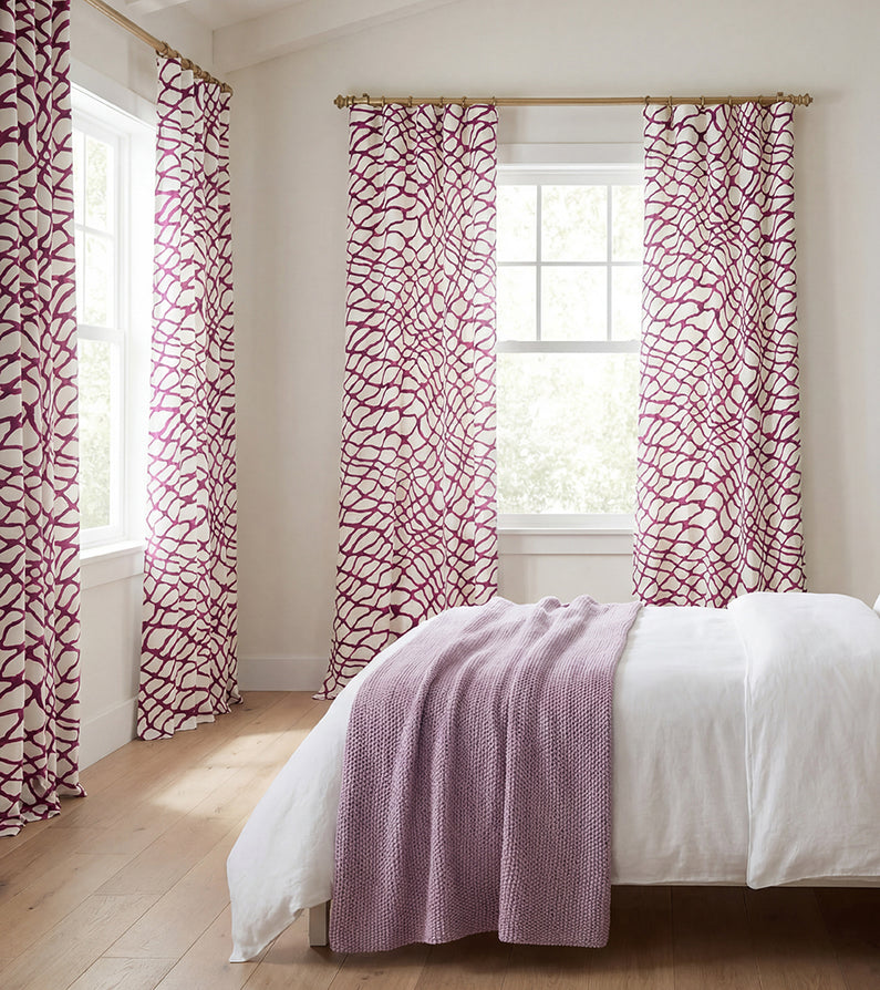 Ellis Pink: Bold pink geometric patterned curtains bring vibrant color and playful contrast to a bright, airy bedroom.