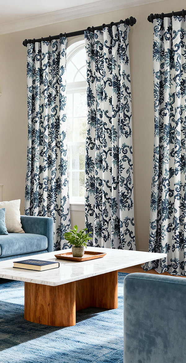 Indonesian Blue: Ornate blue-and-white patterned curtains add timeless character and striking contrast to this sophisticated living room.