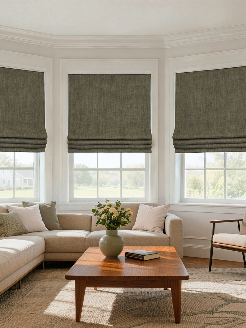 Khaki Green Textured Faux Linen: Khaki green textured Roman shades add natural color and tailored style to a bright, neutral living room.