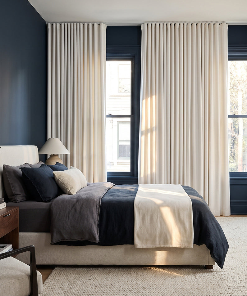 Chalk Off White: Chalk off-white curtains frame tall bedroom windows, creating a bright, polished space with neutral bedding and teal accents.