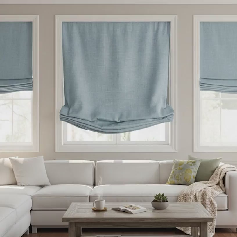 Blue linen roman shades enhancing a bright contemporary living room.